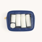 The Simplified Leatherette Travel Bags Bundle includes a blue transparent, TSA-friendly travel bag with five white travel-sized toiletry bottles and a small white container—perfect versatile additions for any journey.