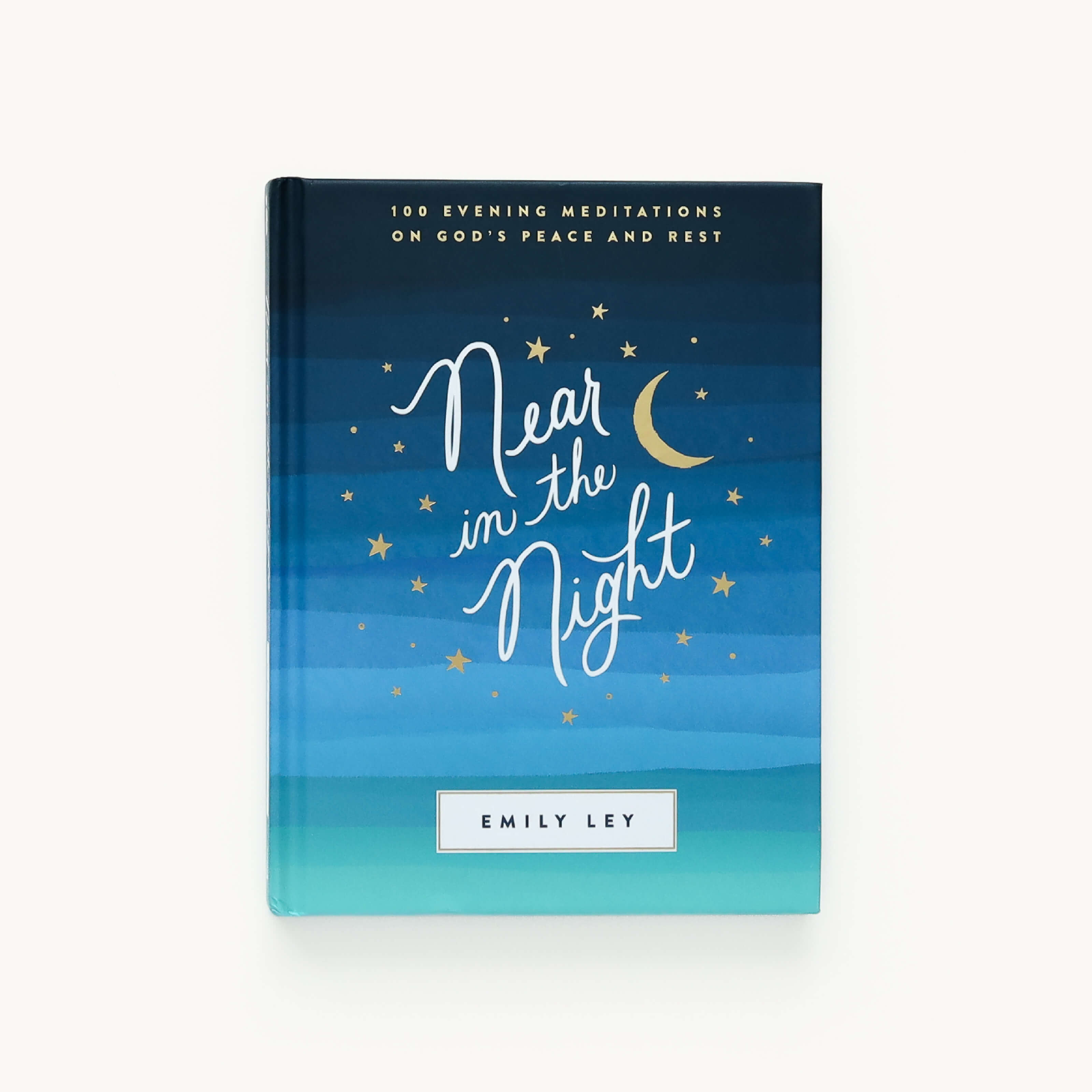 The image shows Near in the Night by Emily Ley, from the Simplified brand. The serene cover has blue gradients, a crescent moon, and stars, inviting calm with its subtitle: 100 Evening Meditations on Gods Peace and Rest.