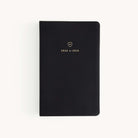 The Simplified 2024-2025 Daily Dapperdesk Planner - Black Tie features a luxurious leatherette cover with elegant gold text, set against a plain white background.