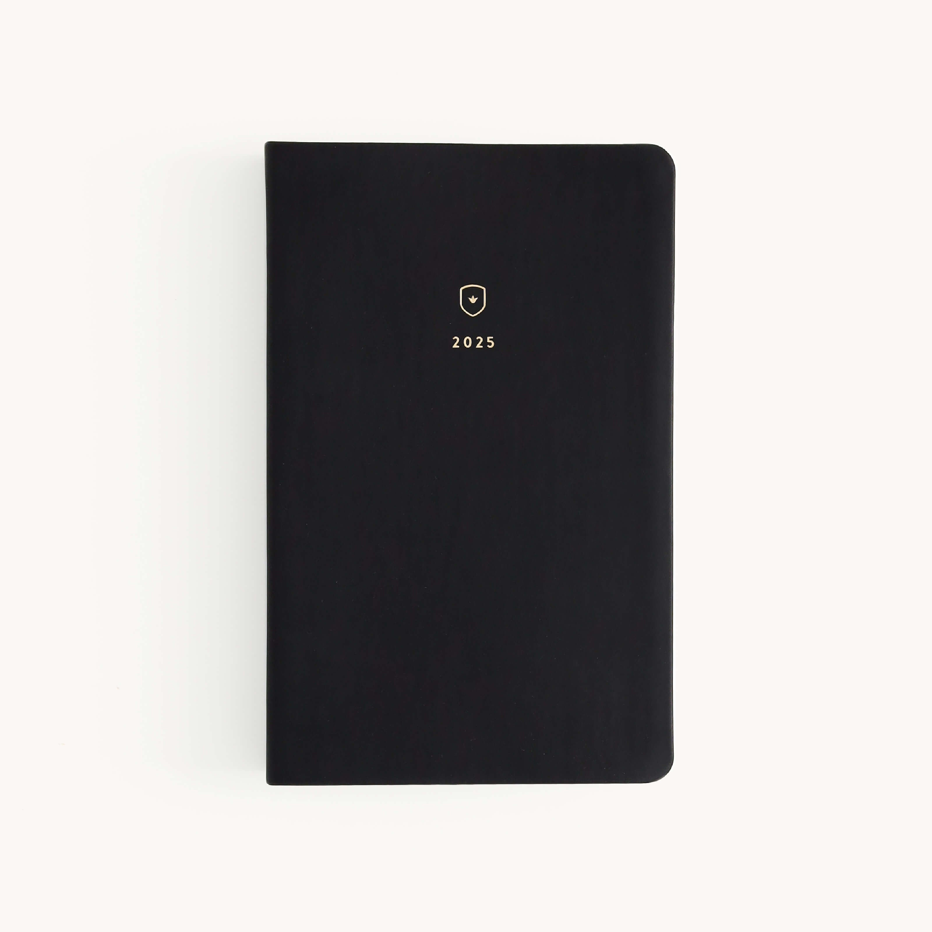 2025 Calendar Year Daily Dapperdesk Planner by Emily Ley featuring the Black Tie leatherette cover with gold foil details.