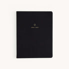 The 2024-2025 Weekly Dapperdesk Planner - Black Tie by Simplified boasts a leatherette cover embossed with gold text, 2024 to 2025, centered elegantly. Its design includes rounded edges, premium paper, and a minimalist aesthetic.