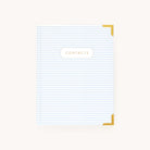 The Simplified Address Book features a white and blue striped cover with gold corners. The word CONTACTS is elegantly displayed in gold on a central white plaque, ideal for organizing holiday mail or essential contacts, set against a light beige background.