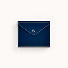 A navy blue envelope with gold lining and a gold laurel wreath emblem on the flap is perfect for any occasion. Part of Simplifieds Boxed Card Set, its elegance stands out against a plain white background.