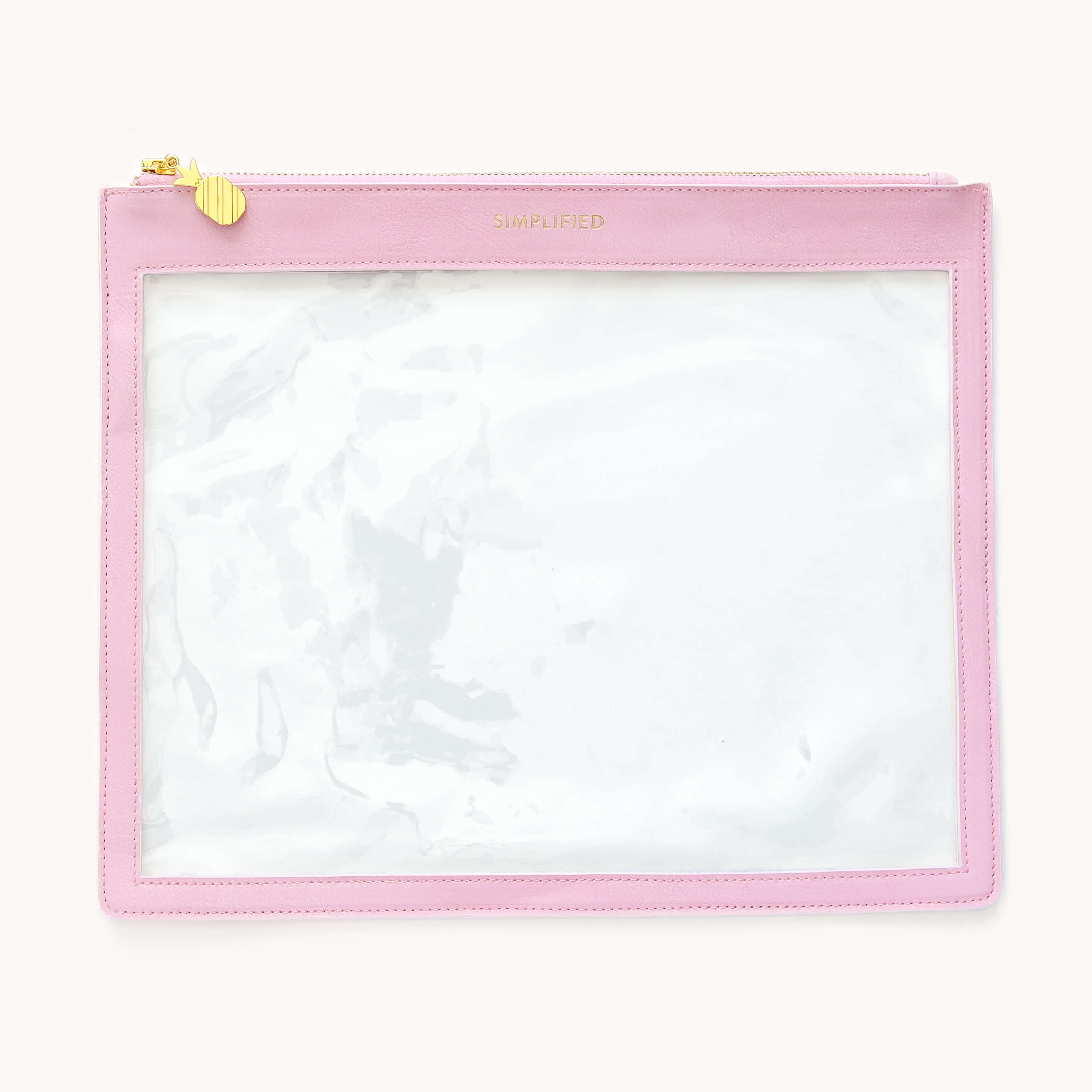 Simplified Clear Pouch in Blush featuring a clear window, gold foil Simplified logo , and gold pineapple zipper pull.