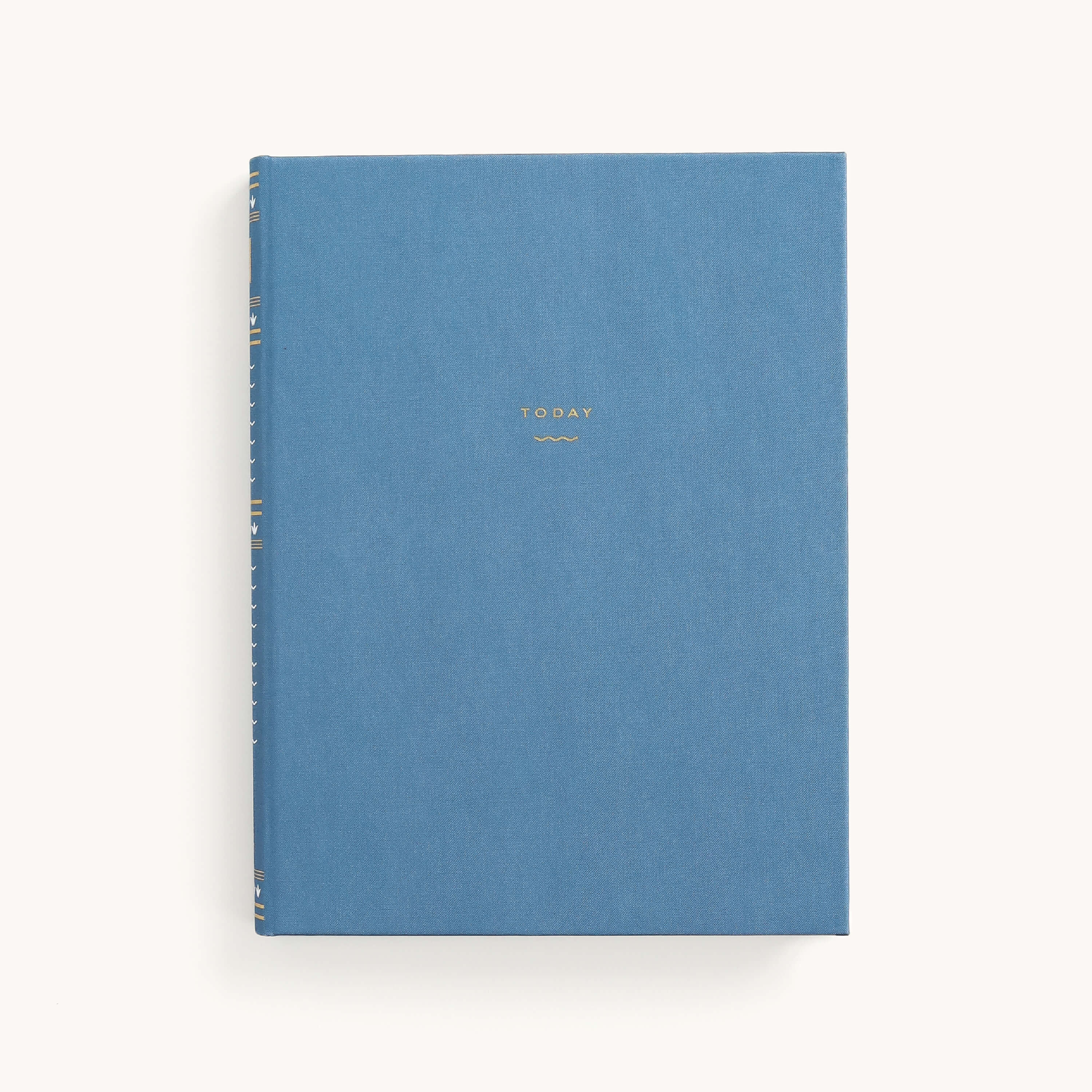 The Simplified Bullet Journal in French Blue, a hardcover adorned only with gold lettering of its title Today, elegantly rests on a plain white background. Its dot-grid pages within the linen cover invite boundless creativity.