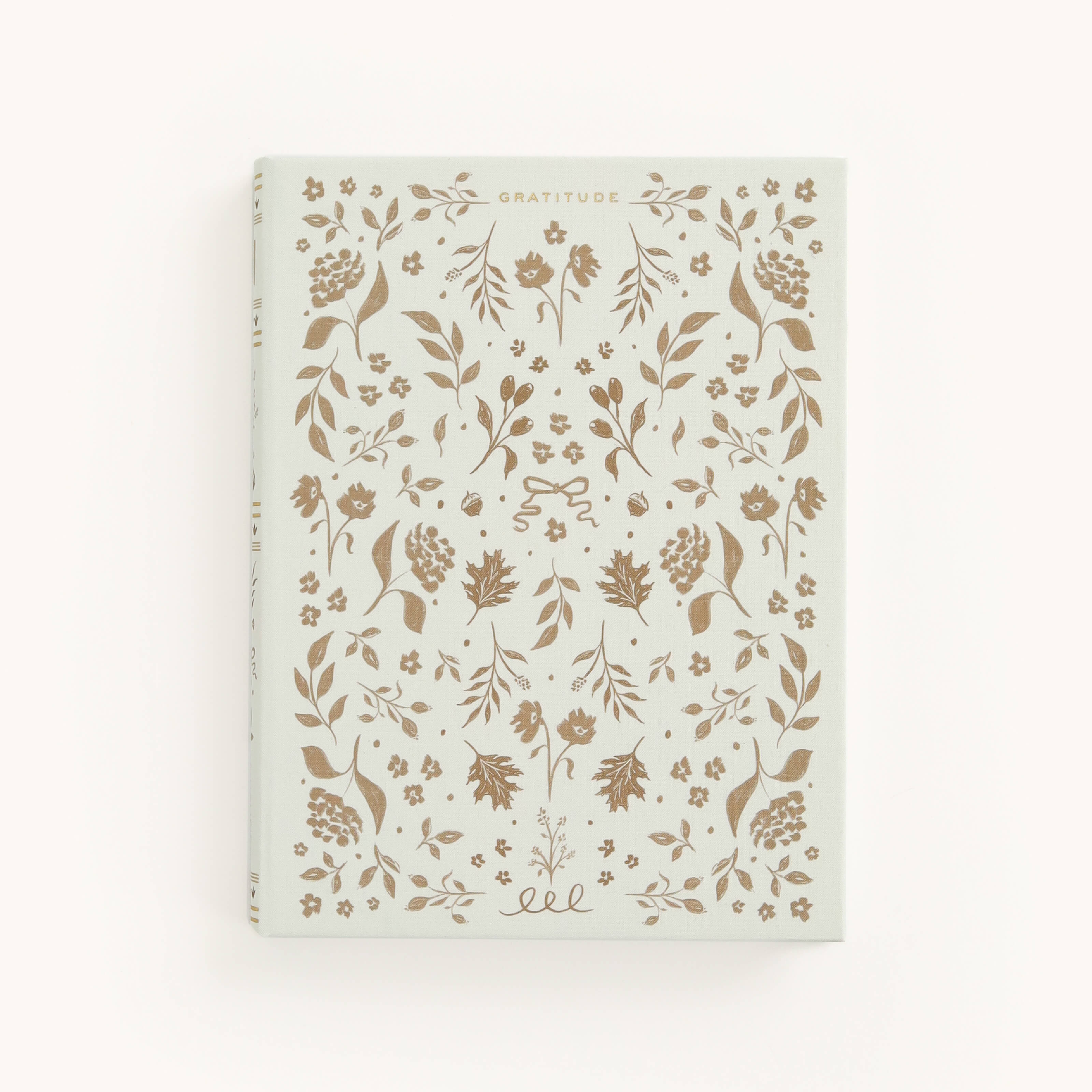 Introducing Simplifieds Linen Journal - Gratitude, featuring a white cover with Gratitude at the top center. This elegant linen hardcover showcases an intricate gold floral and leaf design, perfect for daily reflections.