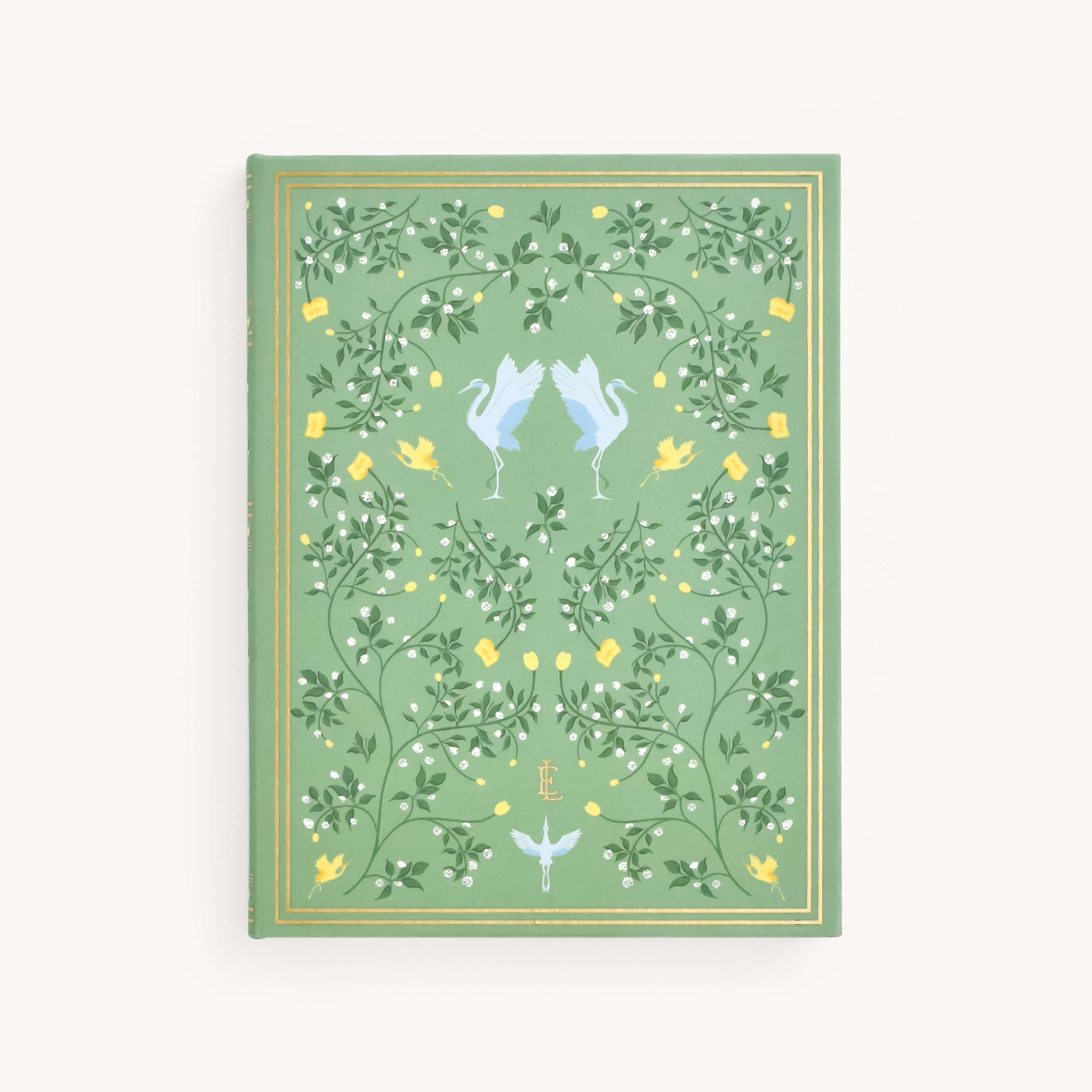 The Linen Journal - Sage by Simplified features a green cover with intricate blue herons, vine patterns, yellow flowers, and small birds. Gold accents embellish the edges, inviting reflection and sparking creativity.