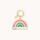 The Simplified Rainbow Key Chain features a vibrant rainbow with Oh Happy Day inscribed below. It includes a gold-toned ring and a rectangular tag, perfect for adding charm to your keys.