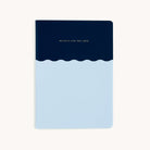 The Simplified Mid-Size Notebook features an elegant design with a dark blue top half and light blue bottom half. In gold, Build a Life You Love is printed on the dark blue section, set against a plain white background.