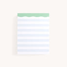 The Simplified Notepad - Blue Stripes features a wavy green top edge and light blue stripes on a white background, ideal for jotting down quick notes to organize your thoughts.