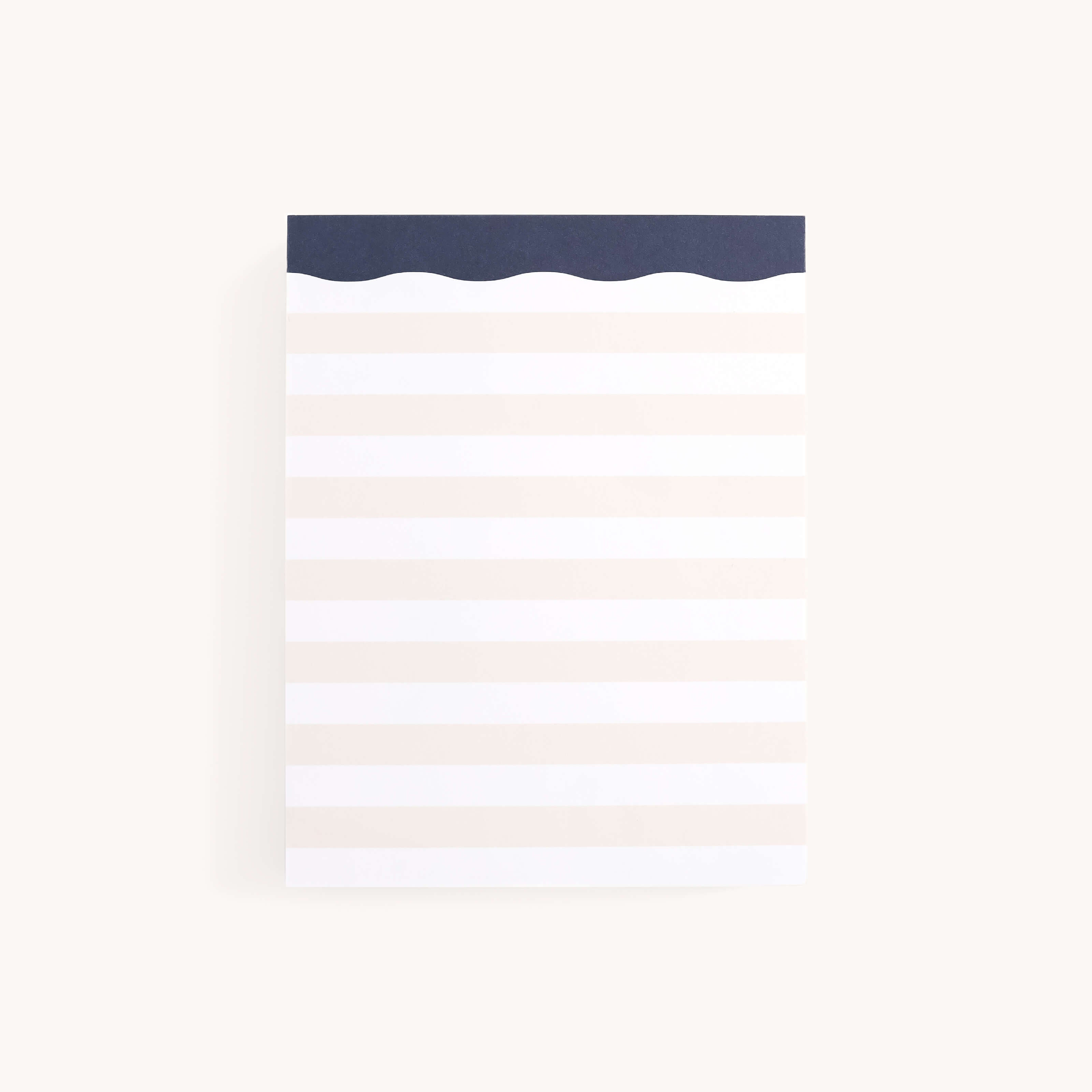 The Simplified Notepad in Cream Stripes has a soothing light gray and white pattern with a dark blue wavy edge, perfect for effortlessly organizing your thoughts.