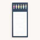 The Tall Notepad - Nutcrackers by Simplified features a navy blue border and a lively row of Happy Stripe Nutcrackers dressed in vibrant pink, orange, green, light blue, and blue.