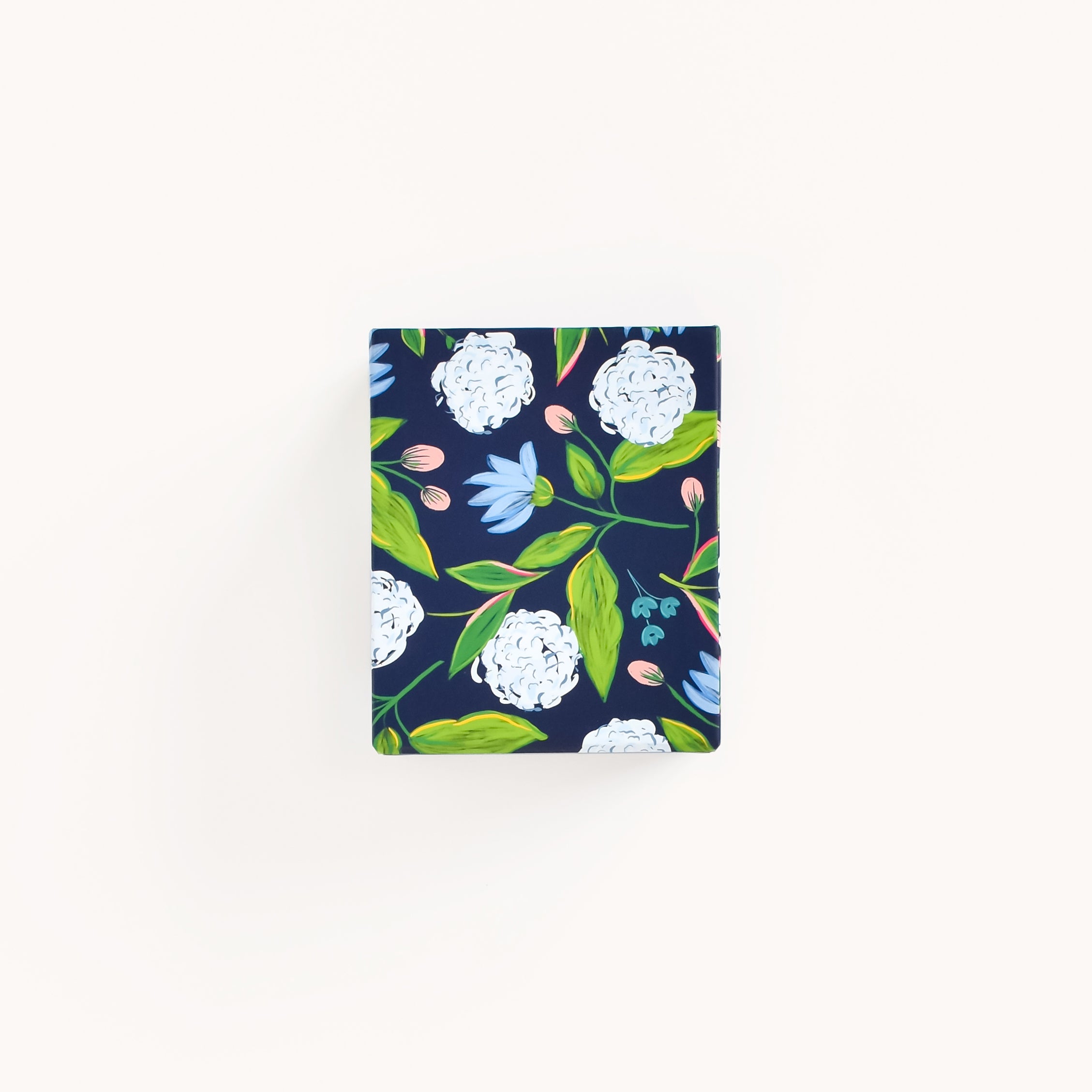 The Patterned Pen Cup - Navy Hydrangeas by Simplified offers a beautiful navy design with white peonies, blue flowers, and green leaves that is perfect for sprucing up your desk.