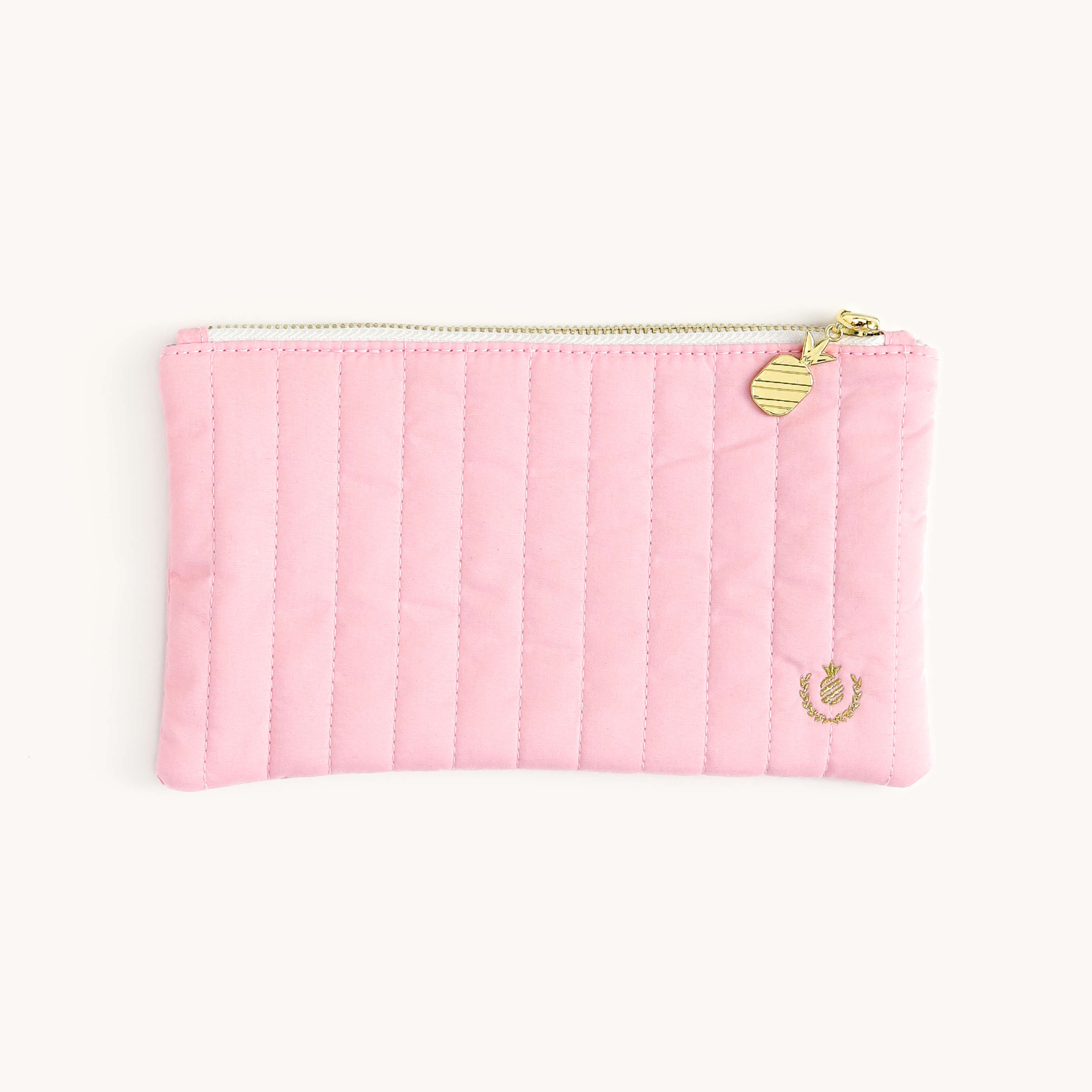 Blush Quilted Pencil Pouch featuring a quilted cotton exterior with shiny gold zipper teeth, a pineapple shaped gold zipper pull, and gold embroidered embellishment. 