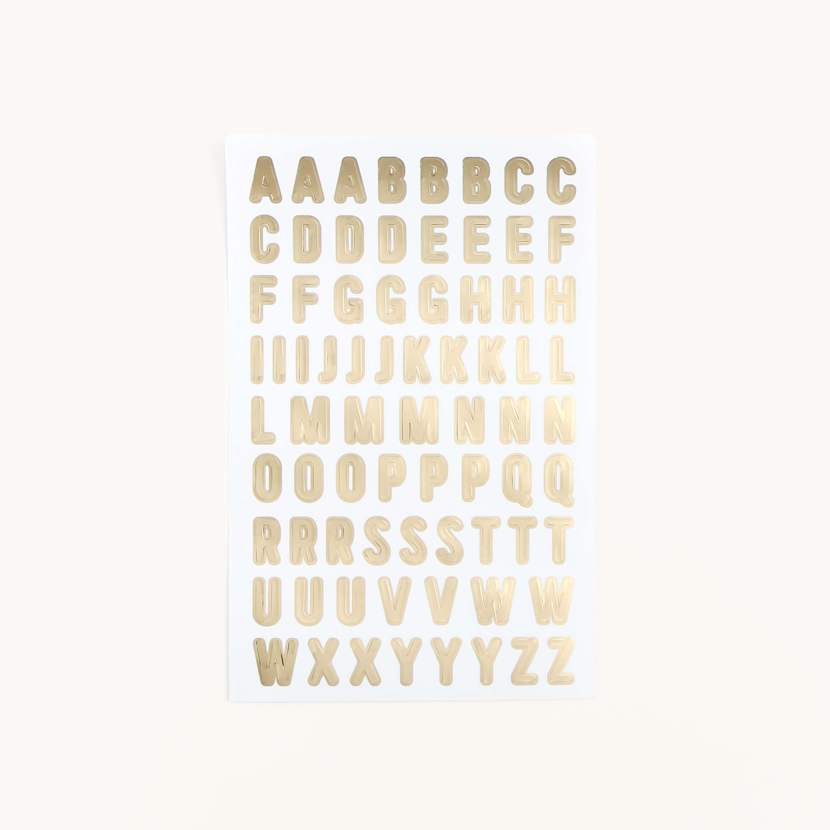 Simplified by Emily Ley | Classic Modern Vinyl Sticker Set, featuring four sheets with with 472 gold foil stickers in a modern font style.