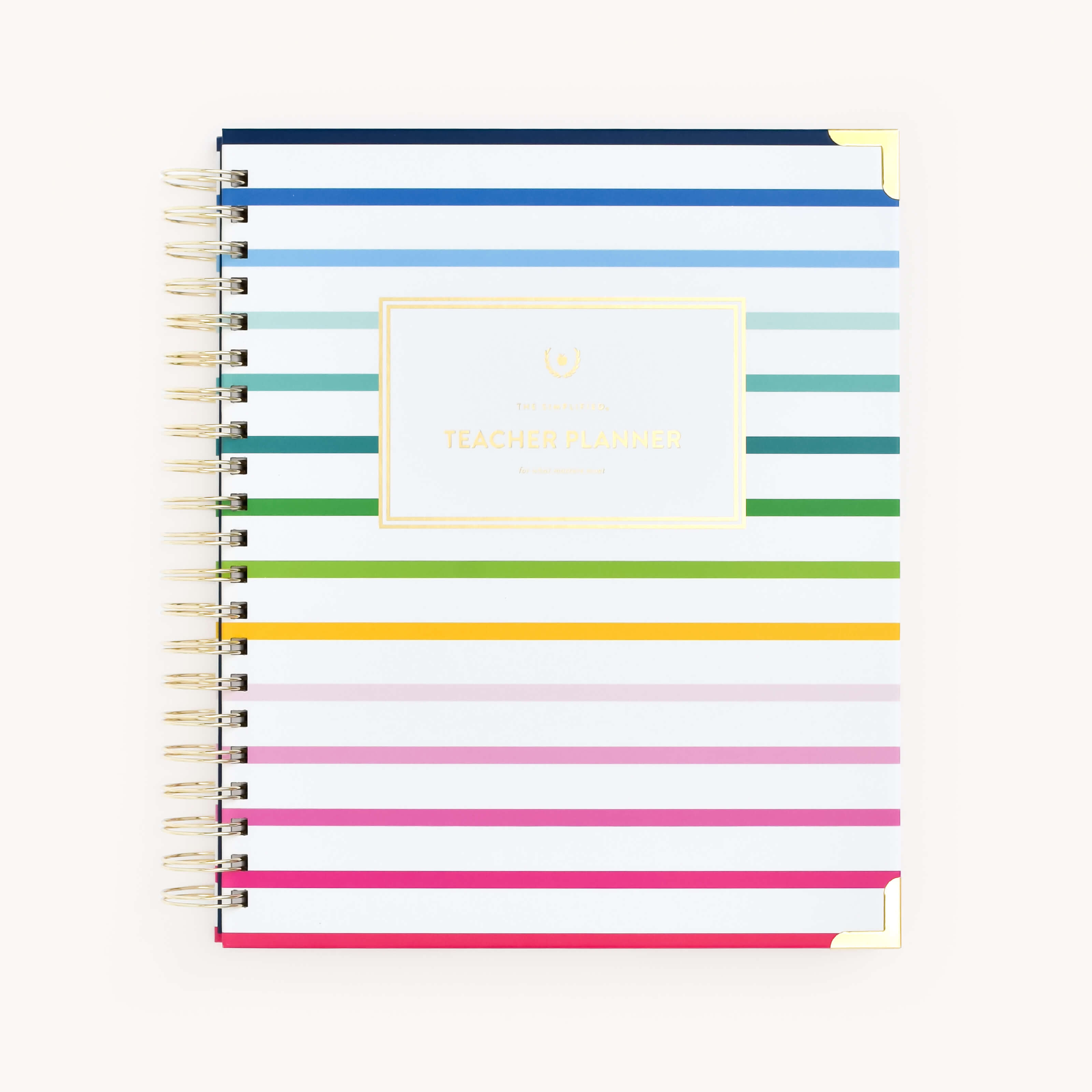 Simplified Undated Teacher Planner by Emily Ley featuring a Happy Stripe cover pattern with gold protective corners and a gold wire-o binding. 