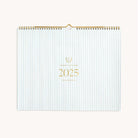 2025 Horizontal Wall Calendar by Emily Ley featuring the Carolina pinstripe design with gold foil details and gold wire-o binding