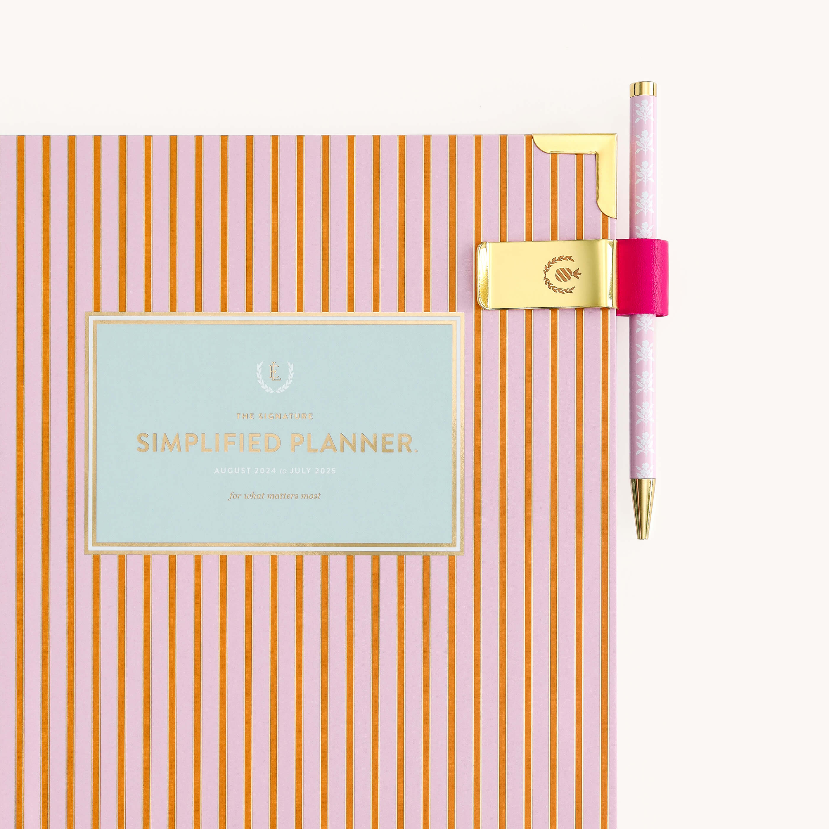 Brass Pen Clip in Rapsberry attached to Simplified Planner cover.