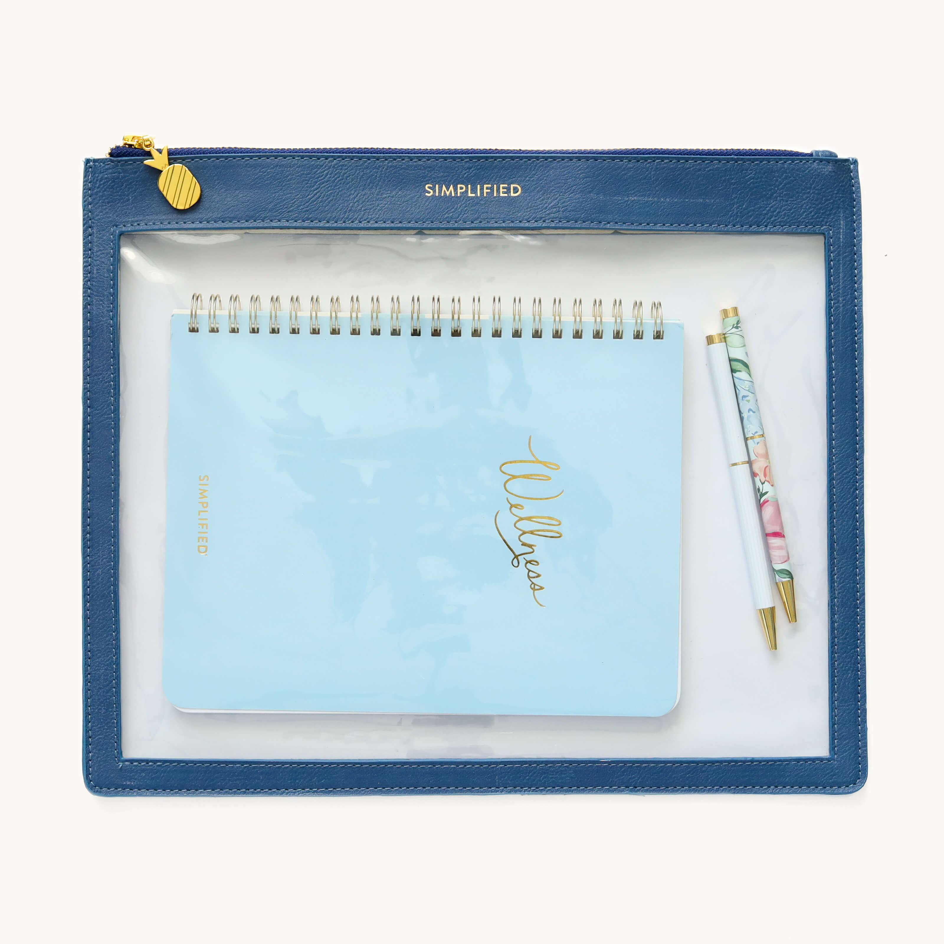 Wellness Workbook and two twist pens fitting inside the Navy Leatherette Pouch.