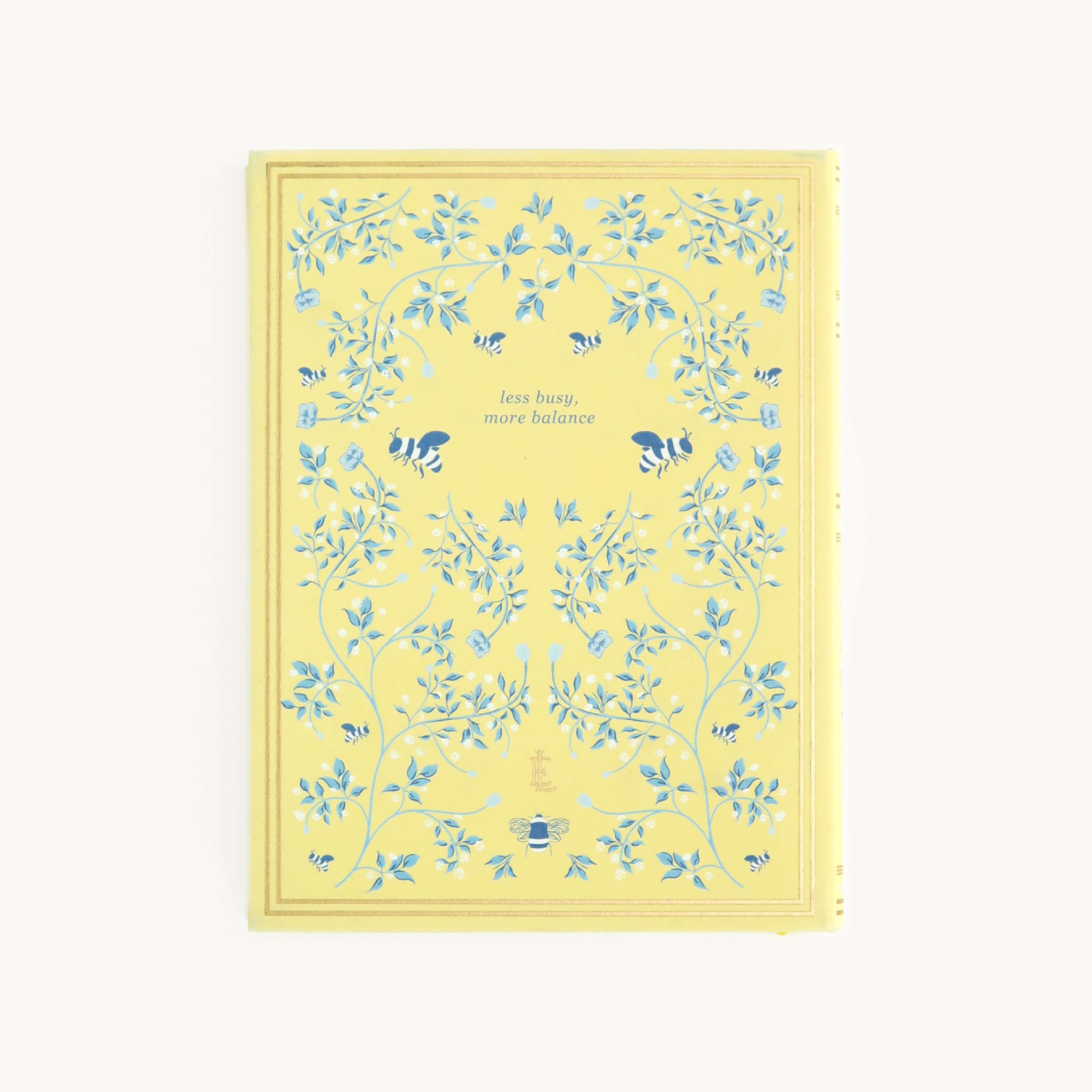 The Linen Journal - Yellow by Simplified features a yellow cover with blue floral patterns and bees, centered with the inspiring text less busy, more balance. Perfect for users seeking creativity and harmony through journaling.