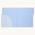 The Simplified Leatherette File Folder in French blue is rectangular and opens flat, featuring a rounded pocket inside left for secure document storage. Its smooth texture and stitched edges ensure stylish office organization in a soft pastel hue.