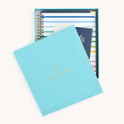 Simplified Undated teacher Planner by Emily Ley placed inside a teal keepsake box. Includes a hand-lettered gold-foil inspirational insert card.