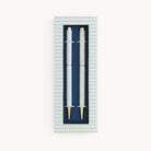 Simplified by Emily Ley | Twist Pen Set featuring two metal pens in Coastal Stripe and Ivory Antelope designs, shown in a Coastal Stripe two-piece box with a clear view window.