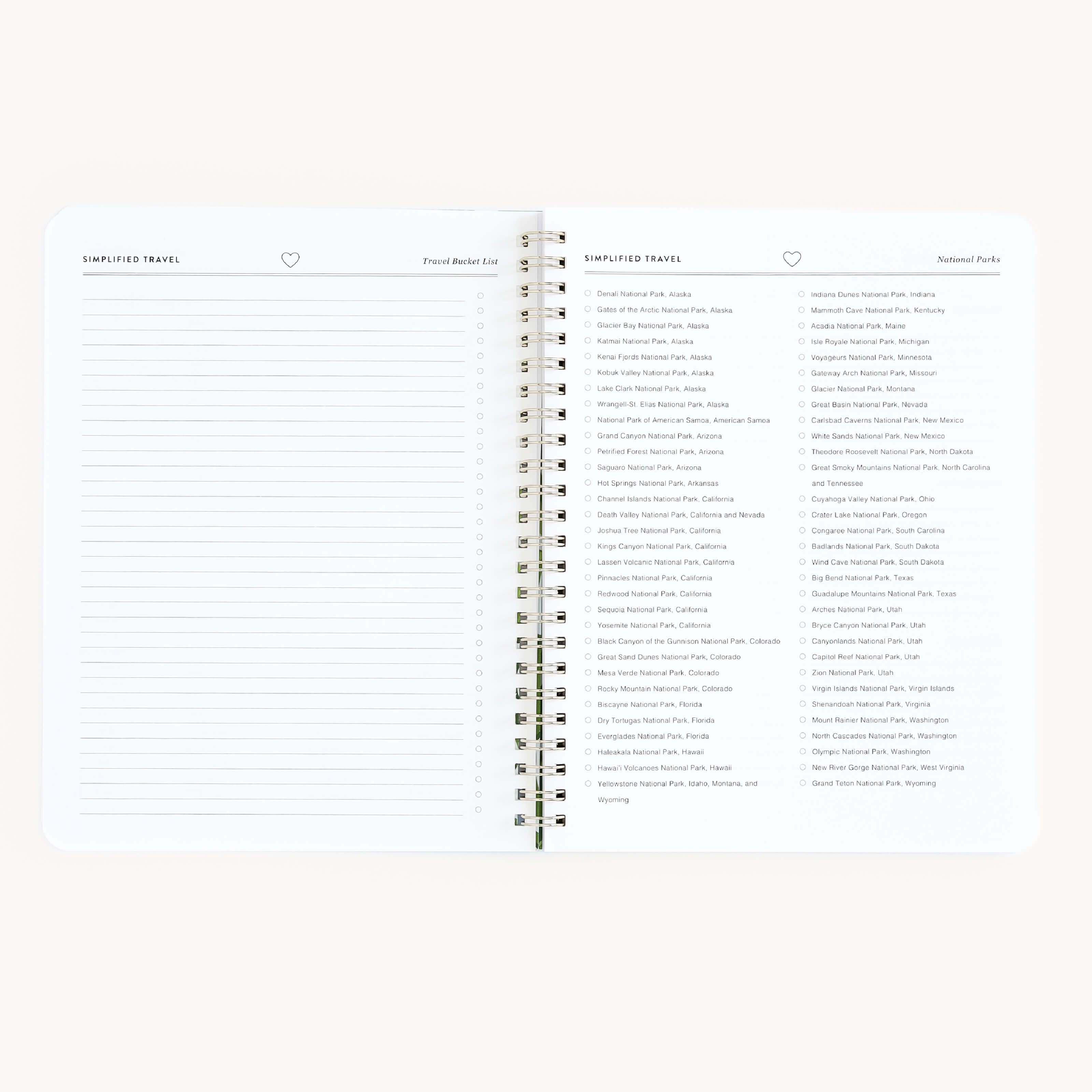 The Simplified Workbook - Travel Planning is an open spiral-bound planner featuring lined pages for notes and itineraries on the left, and a list of national parks like Grand Teton in Wyoming and Acadia in Maine with checkboxes on the right to track your adventures.