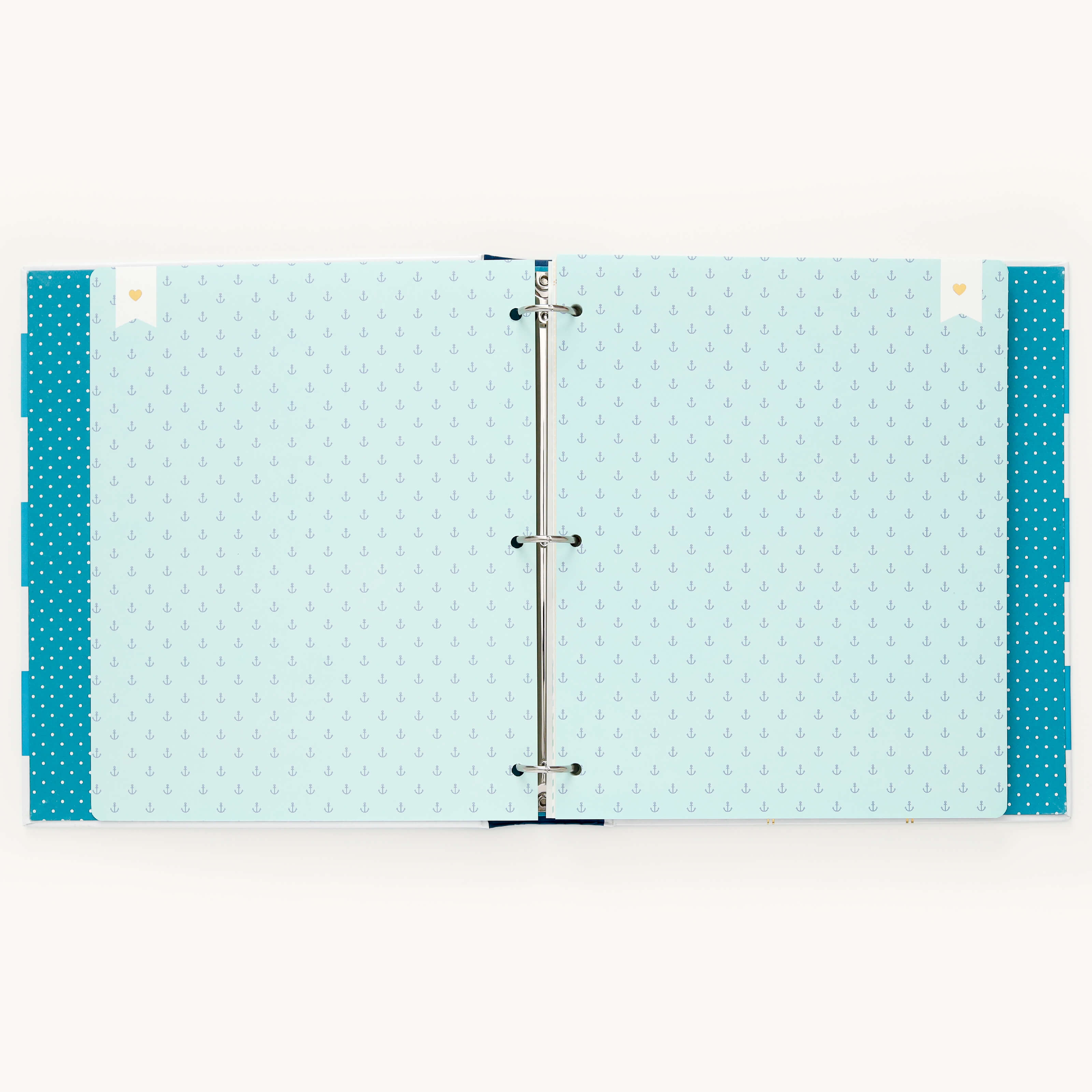 The Big Kid Book - Teal by Simplified features a light blue interior with anchor patterns. Its metal rings are perfect for holding memories, and it has teal edges dotted in white, making it an ideal keepsake for capturing memorable moments of child growth.