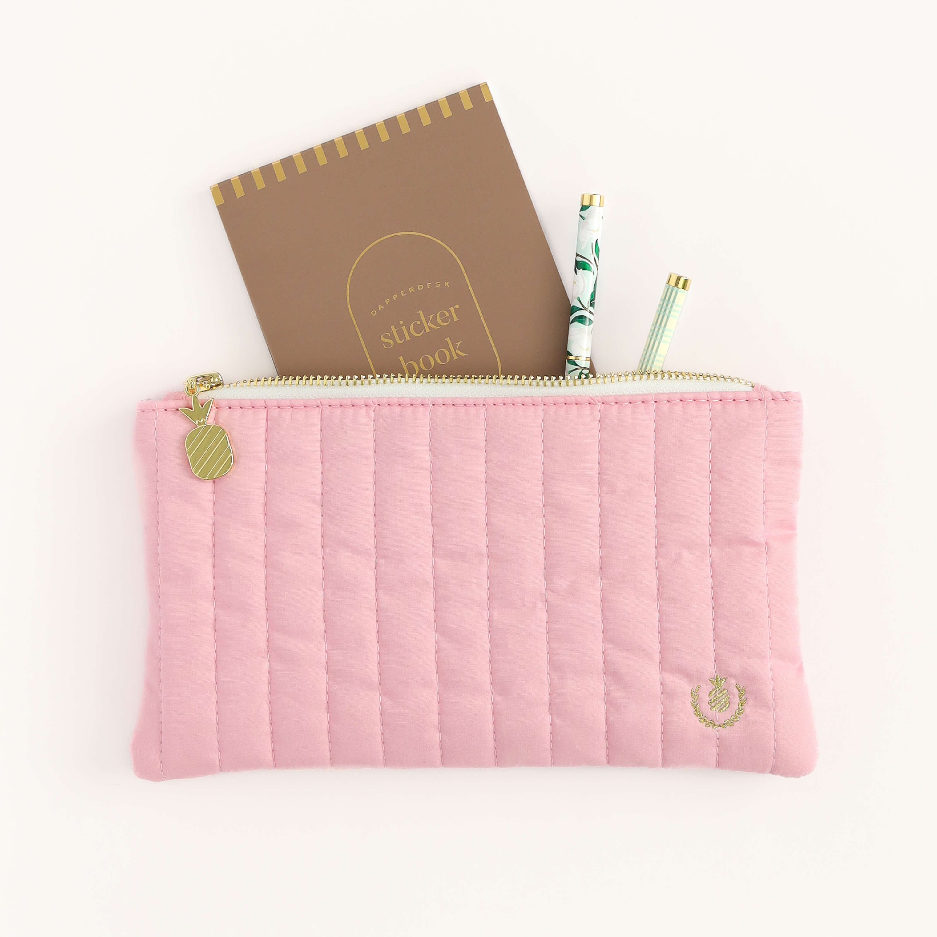 Simplified Sticker Book and two twist pens peeking out from the Blush Quilted Pencil Pouch.