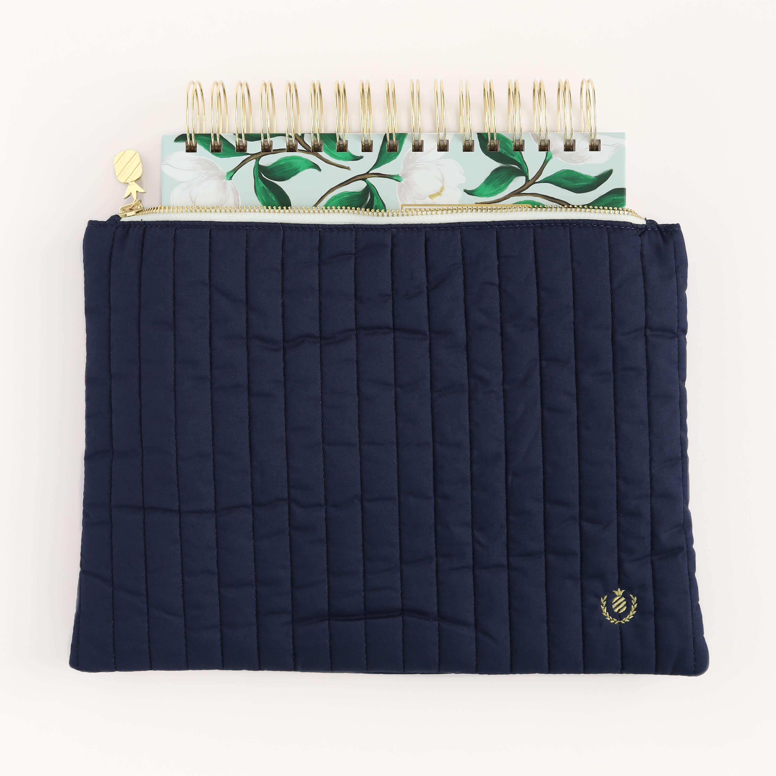 Savannah Blooms Simplified Planner peeking out from the Navy Quilted Pouch.