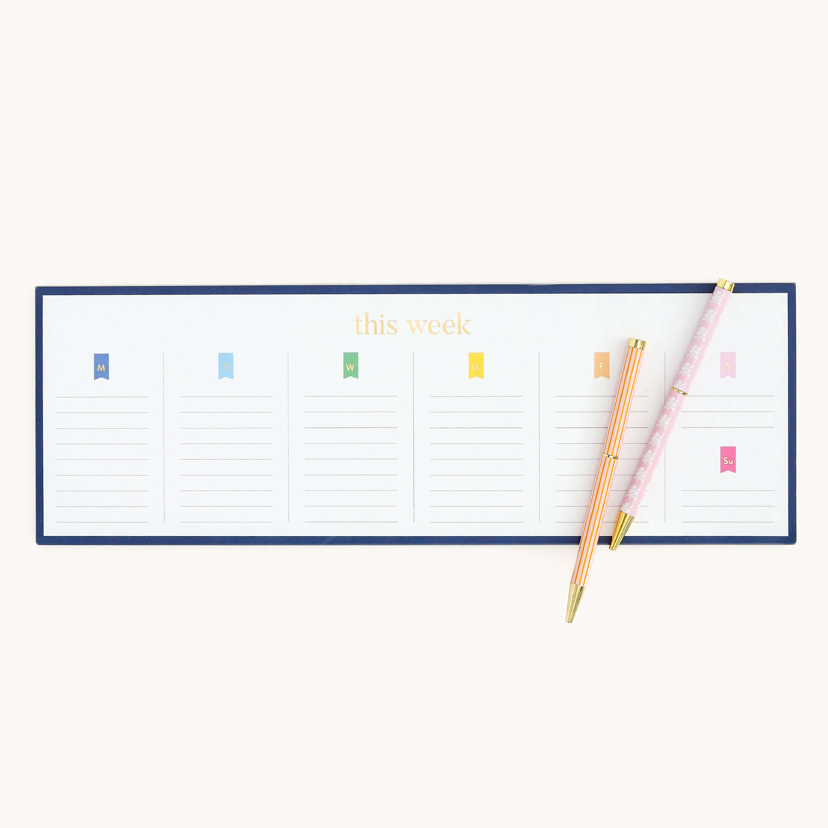 Simplified by Emily Ley | Twist Pen Set featuring two metal pens in Cabana Pinstripe and Blush Block designs used alongside the Weekly Keyboard notepad.