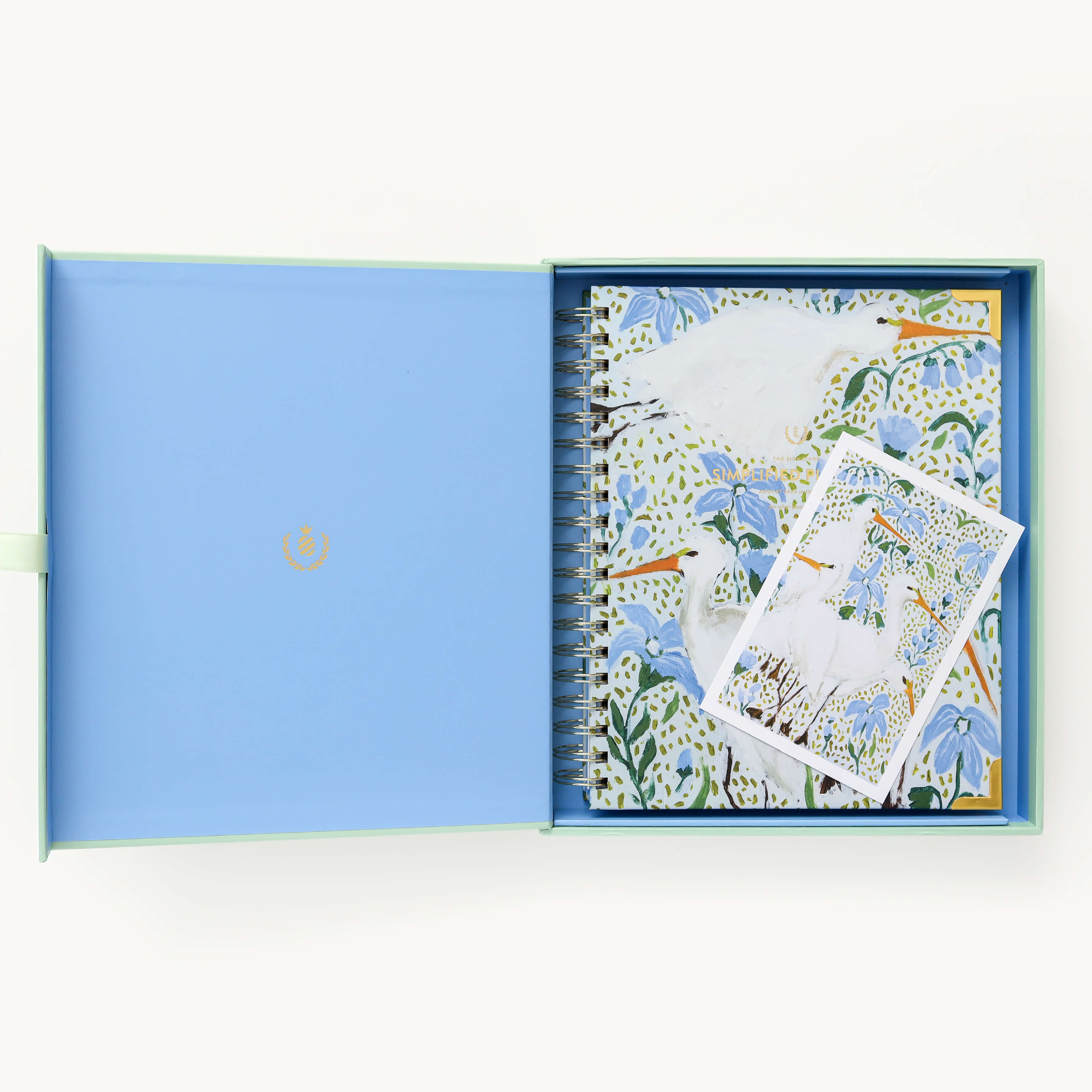 2024-2025 Academic Year Weekly Simplified Planner by Emily Ley in the Beaufort Birdies cover design, placed inside a light blue and green keepsake box with gold foil detailing. Includes a matching art print for added inspiration. Perfect for organization, time management, and productivity. 