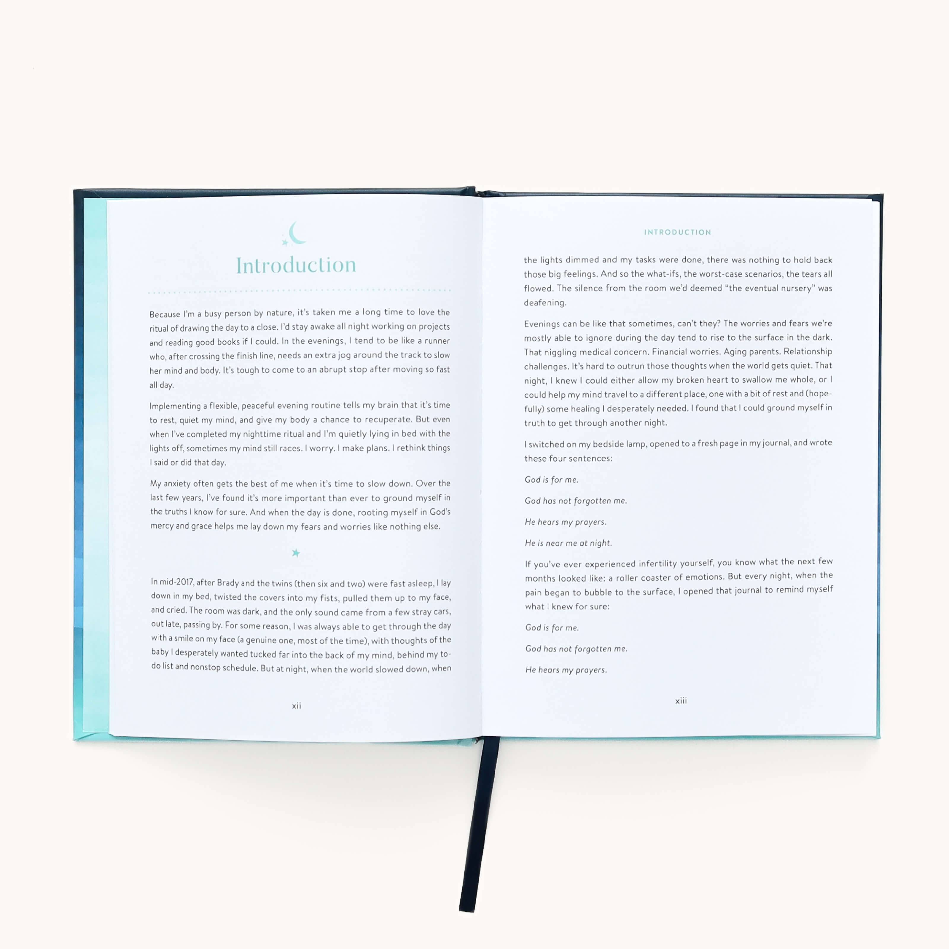 The book Near in the Night by Emily Ley from Simplified features an open spread. The left page, titled Introduction, has reassuring narrative text in a calm serif font, while the right page continues with more paragraphs. A ribbon bookmark softly rests between the evening devotions.