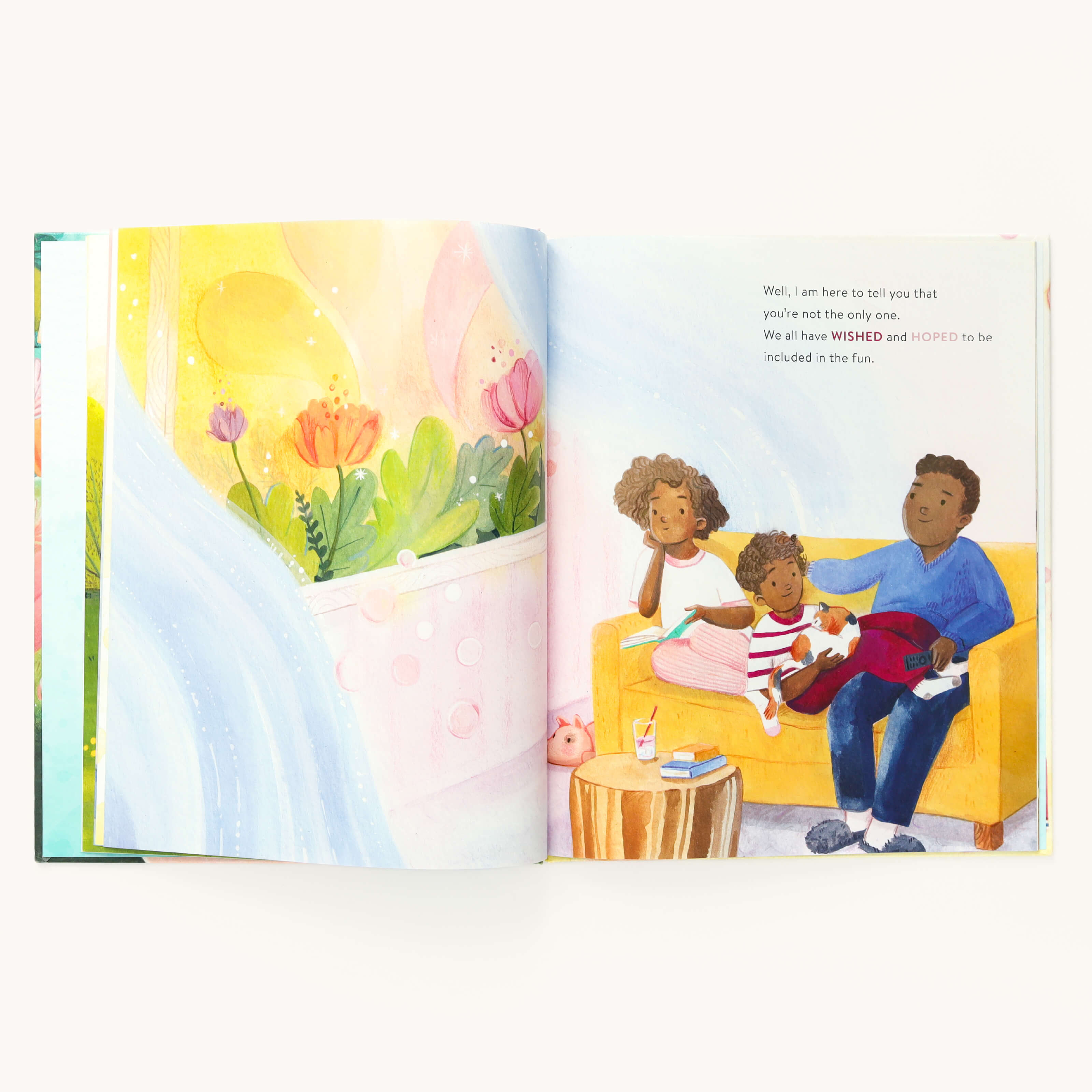 In Youll Always Have a Friend by Emily Ley, from Simplified, a parent and two kids are depicted enjoying a story on a yellow couch. Illustrated bright flowers adorn one page, while the other page gently discusses themes of loyalty and inclusion in fun activities.