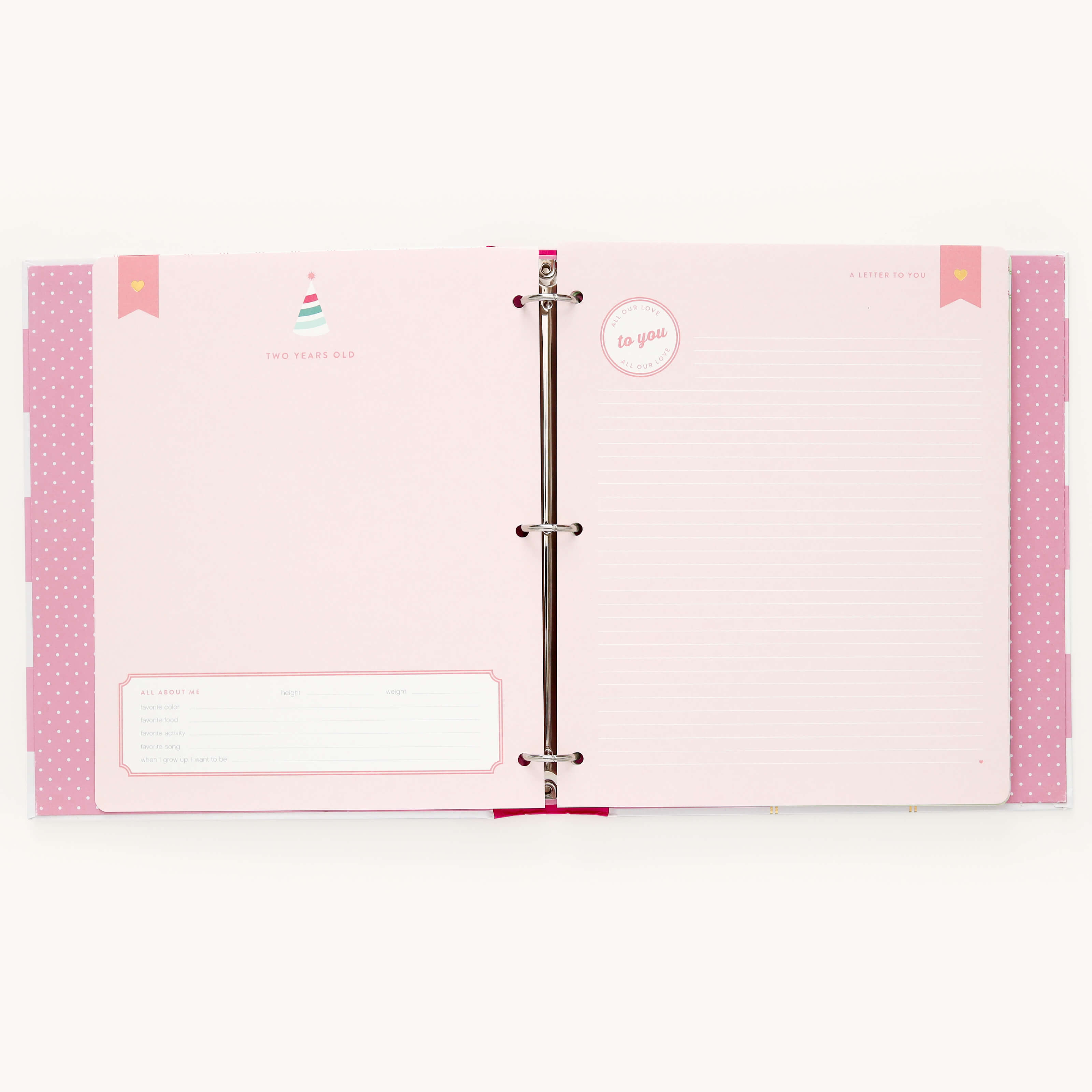 Open the Simplified Big Kid Book - Raspberry, featuring colorful pages with sections for notes and Age About Me info. Adorned with party hat graphics and pink polka dot accents, its perfect for documenting your childs adventures.