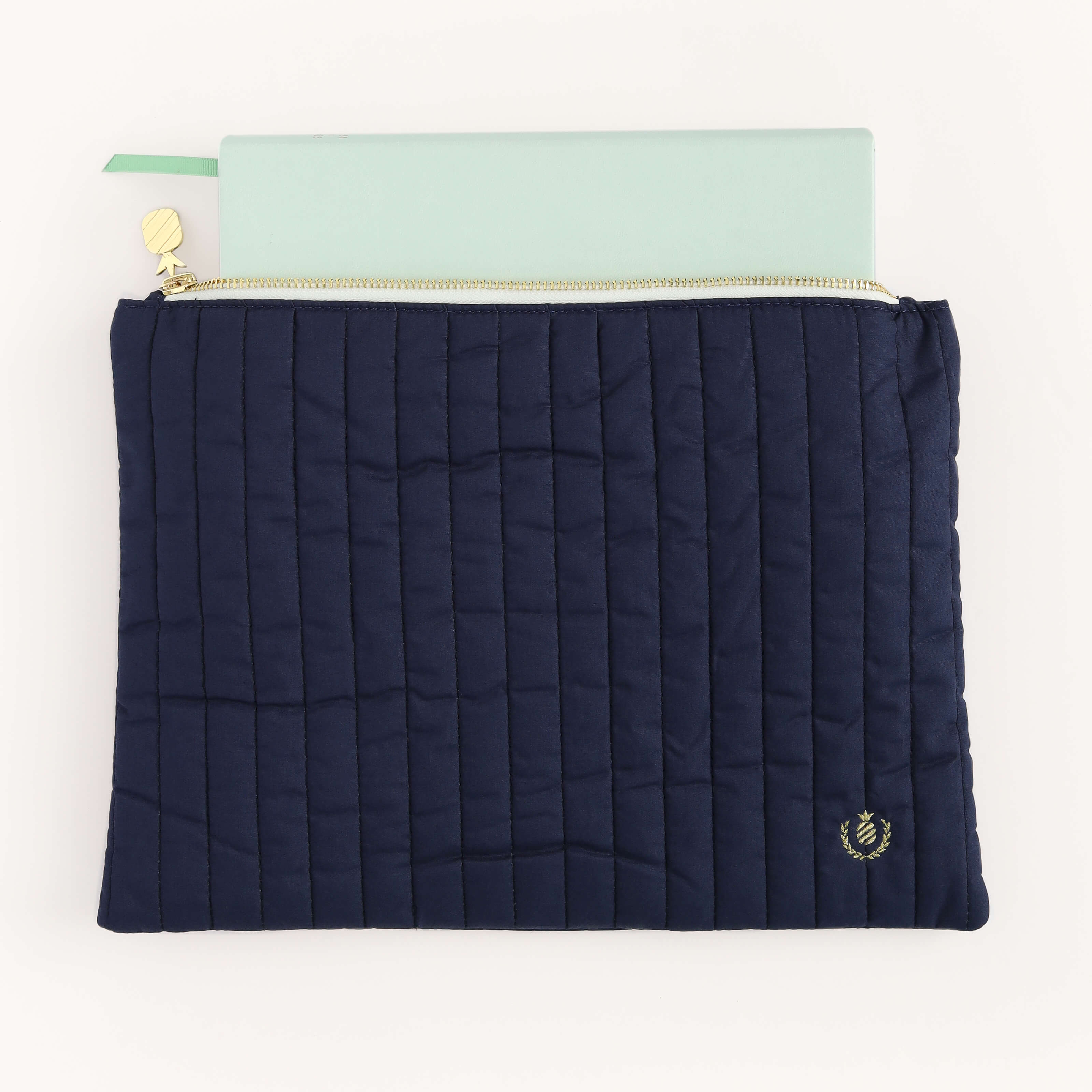 Weekly Dapperdesk Planner peeking out of the Navy Quilted Pouch.