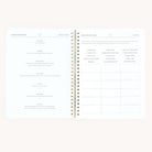 The Simplified Workbook - Wellness features an open layout with sections for daily intentions from Monday to Saturday on the left page and a goal-tracking grid on the right, all spiral-bound to help you prioritize self-care throughout your week.