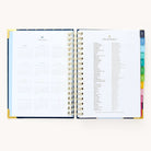 2024-2025 Daily Simplified Planner by Emily Ley in the Dainty Dot cover design open to the yearly calendar overview and holidays list. Features a two-page spread with a full 12-month calendar view on the left and important U.S. holidays on the right. 