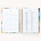 2024-2025 Daily Simplified Planner by Emily Ley in the Savannah Blooms cover design open to the yearly calendar overview and holidays list. Features a two-page spread with a full 12-month calendar view on the left and important U.S. holidays on the right. 