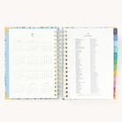 2025 Daily Simplified Planner by Emily Ley in the Beaufort Birdies cover design open to the yearly calendar overview and holidays list. Features a two-page spread with a full 12-month calendar view on the left and important U.S. holidays on the right. 