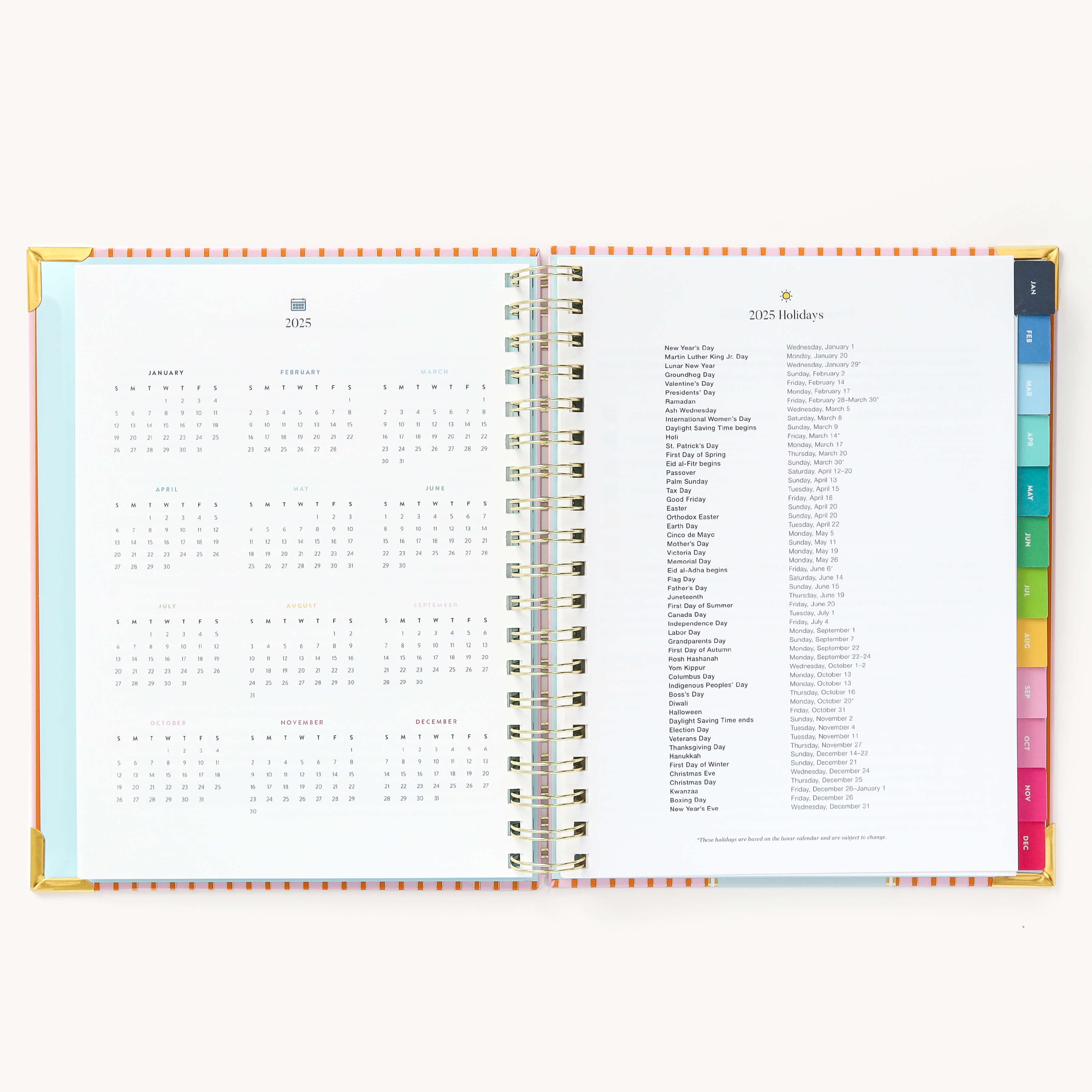 2025 Weekly Simplified Planner by Emily Ley in the Cabana Pinstripe cover design open to the yearly calendar overview and holidays list. Features a two-page spread with a full 12-month calendar view on the left and important U.S. holidays on the right. 