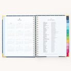 2024-2025 Weekly Simplified Planner by Emily Ley in the Dainty Dot cover design open to the yearly calendar overview and holidays list. Features a two-page spread with a full 12-month calendar view on the left and important U.S. holidays on the right. 