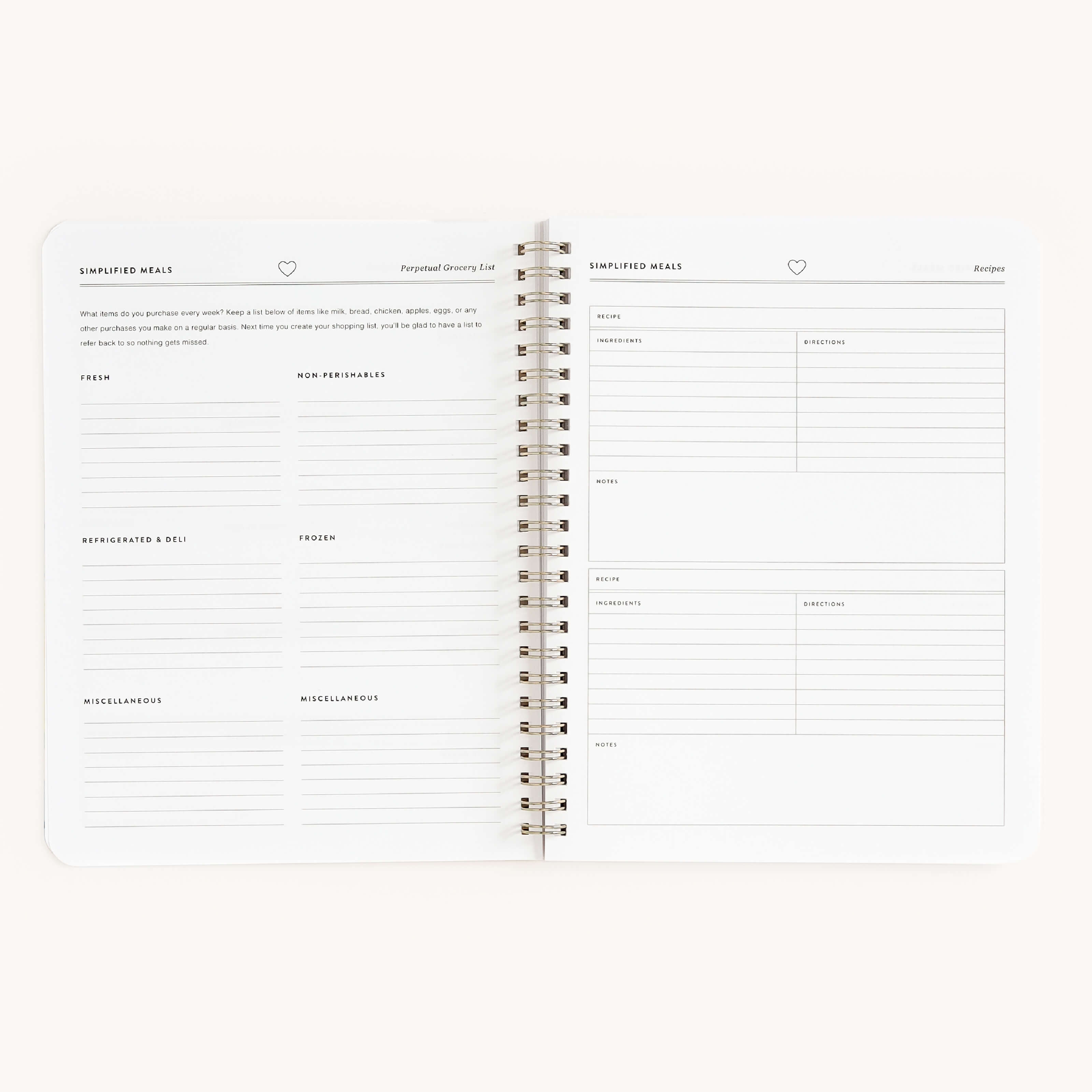 The Simplified Workbook - Meal Planning is an open spiral-bound planner featuring sections for Simplified Meals and a Perpetual Grocery List, with pages organized into categories like produce, frozen, and miscellaneous for efficient meal planning and grocery shopping.