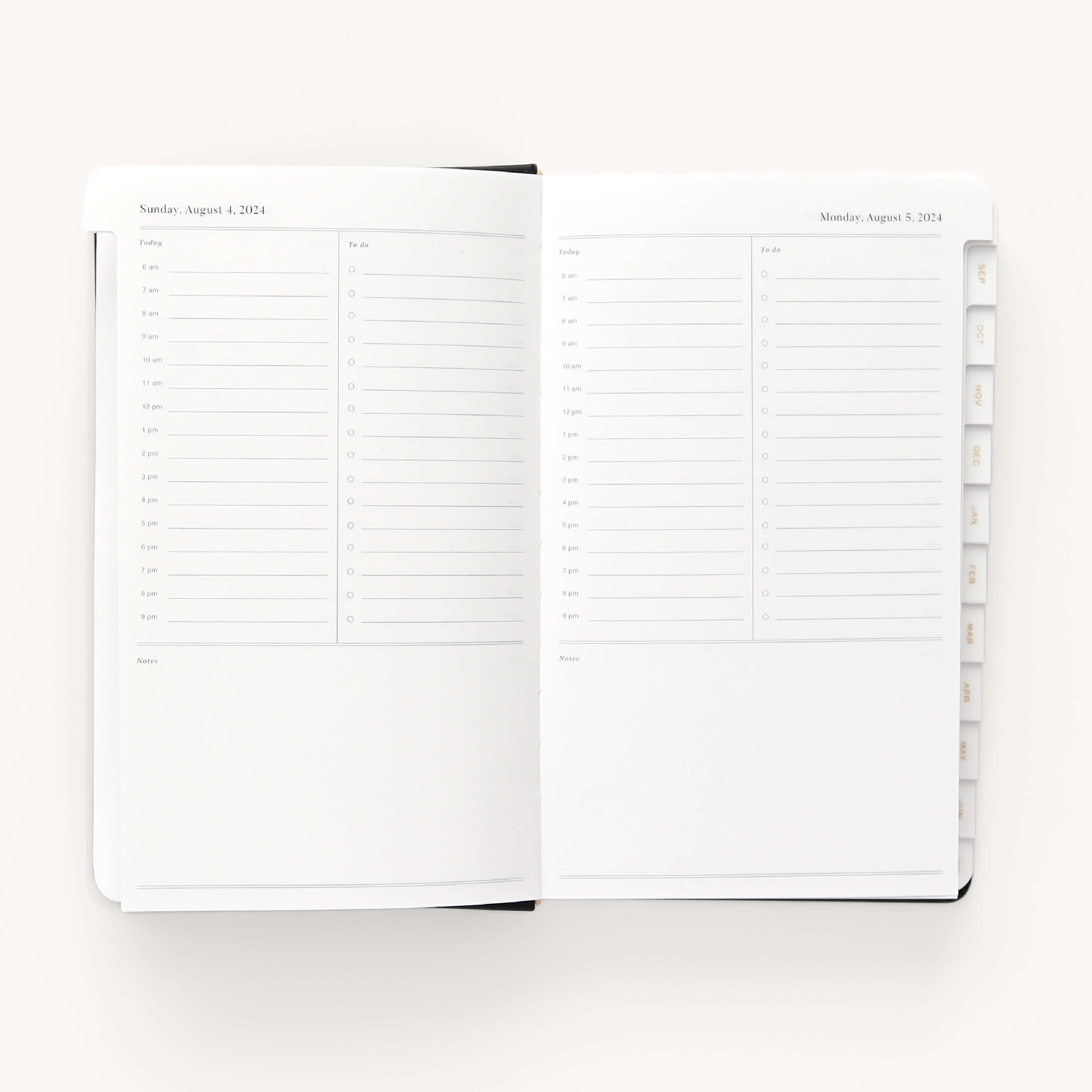 Open the Simplified 2024-2025 Daily Dapperdesk Planner - Black Tie to find a sleek leatherette cover, hourly schedules for Sunday, August 4, and Monday, August 5, 2024. This elegant planner features a clean layout with right-side tabbed dividers over its 12-month span.