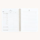 The Simplified Workbook - Finances features an open spiral-bound design. The left page has a monthly budget layout with categories and columns for estimated and actual amounts, perfect for financial goals. The right page is lined for notes, ideal for managing money effectively.