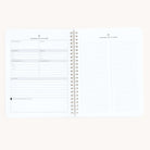 The open Simplified Workbook - Travel Planning shows two spiral-bound pages. The left page has sections for daily plans, goals, meals, activities, and travel plans. The right page, labeled Extended To-Do Planner, is lined for notes.