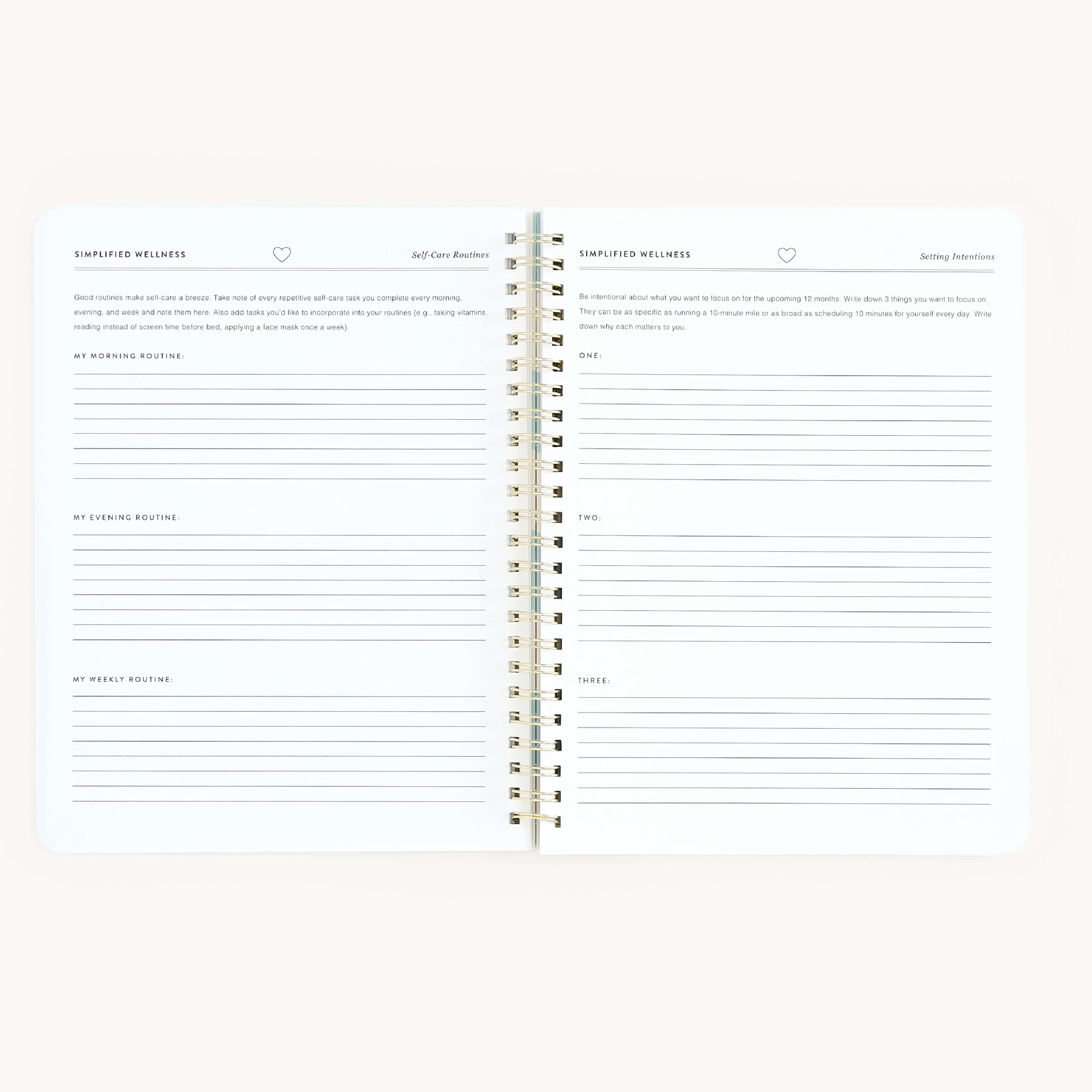 The Simplified Workbook - Wellness is a spiral-bound notebook featuring lined pages. The left page includes sections for My Morning Routine, My Evening Routine, and My Weekly Routine to track goals, while the right page offers sections for small tasks or self-care activities, leaving space for creativity.