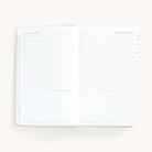 2025 Daily Dapperdesk Planner by Emily Ley in the Sea Salt leatherette cover open to a two-page daily spread featuring Sunday and Monday. Features a clean, minimalistic design with lined sections for daily tasks, to-do lists, and notes.