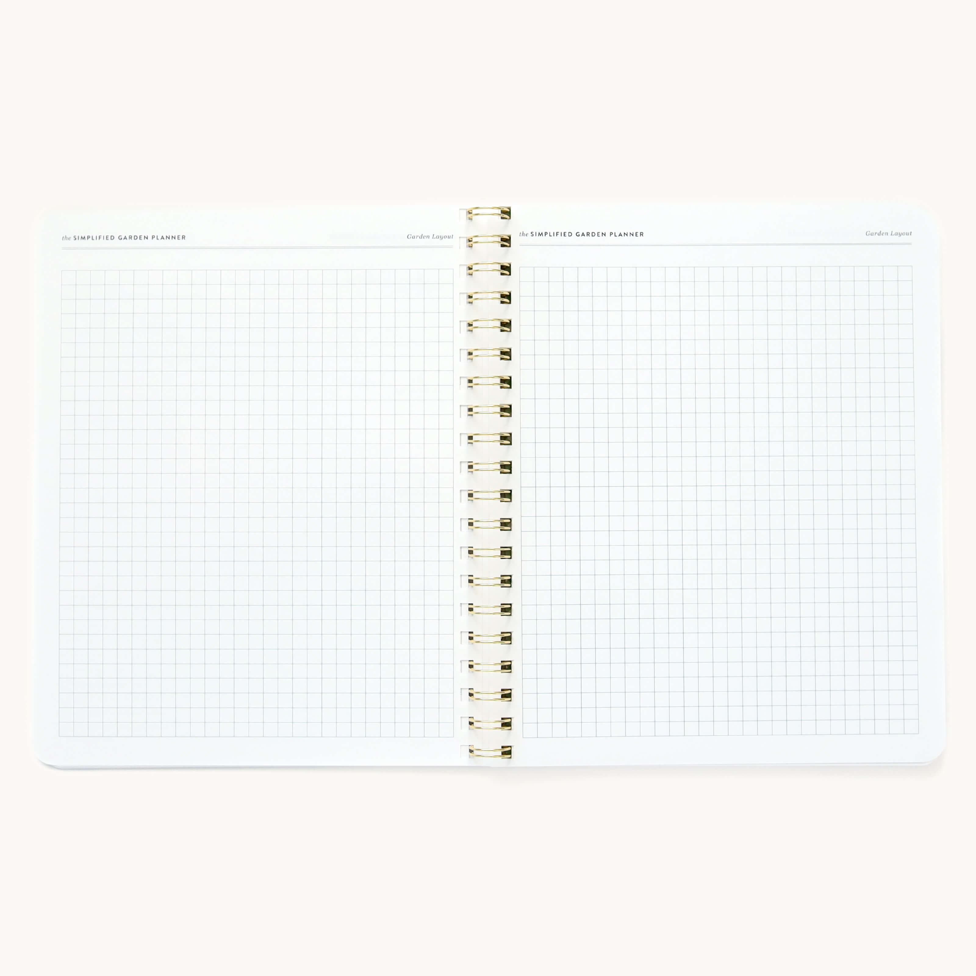 Simplified Garden Planner by Emily Ley open to a two-page grid notes spread. Features blank graph paper.